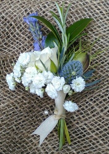 White and blue buttonhole on hessian